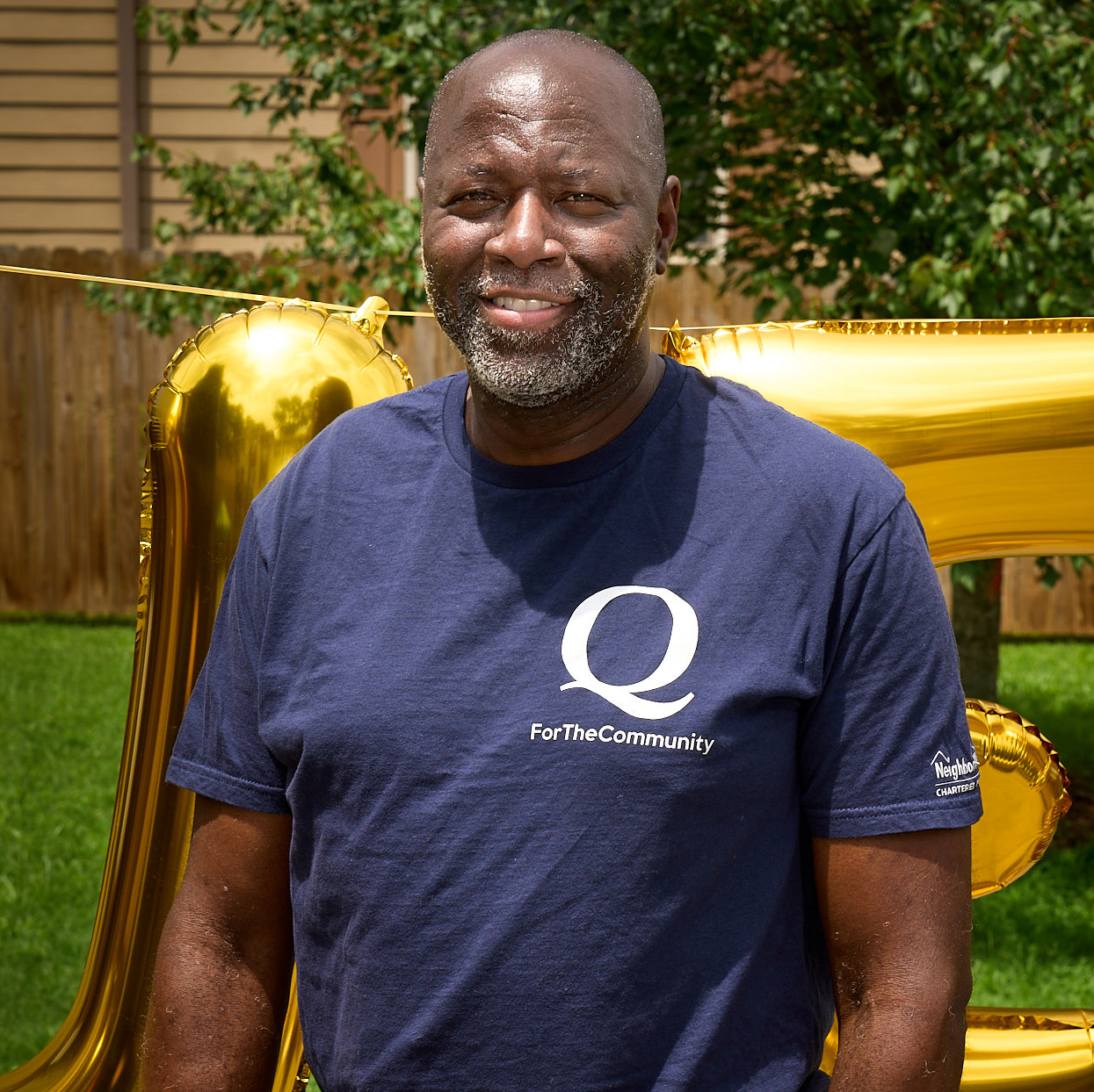 a man in a t-shirt, smiling