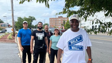 five people participate in a charity walk