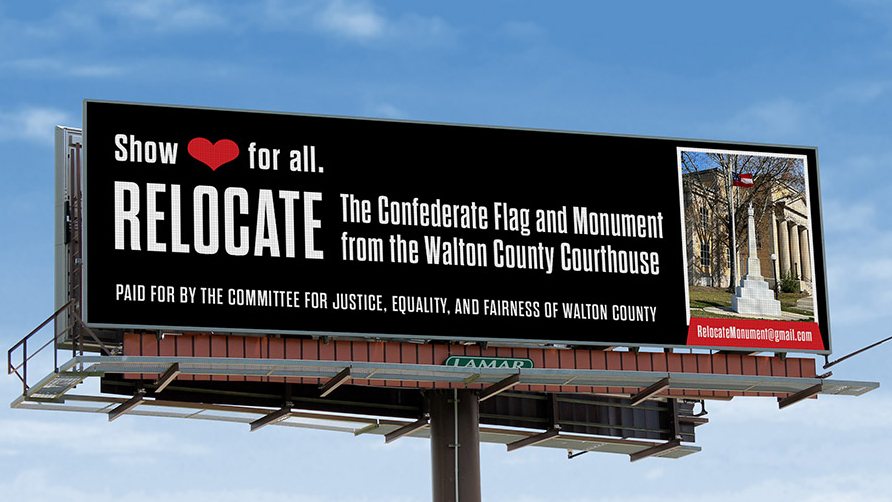 A billboard that reads: "Show love for all. Relocate the Confederate flag and monument from the Walton County Courthouse. Paid for by the Committee for Justice, Equality, and Fairness of Walton County"