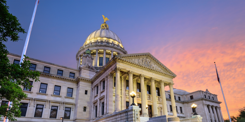 a government building at sunset